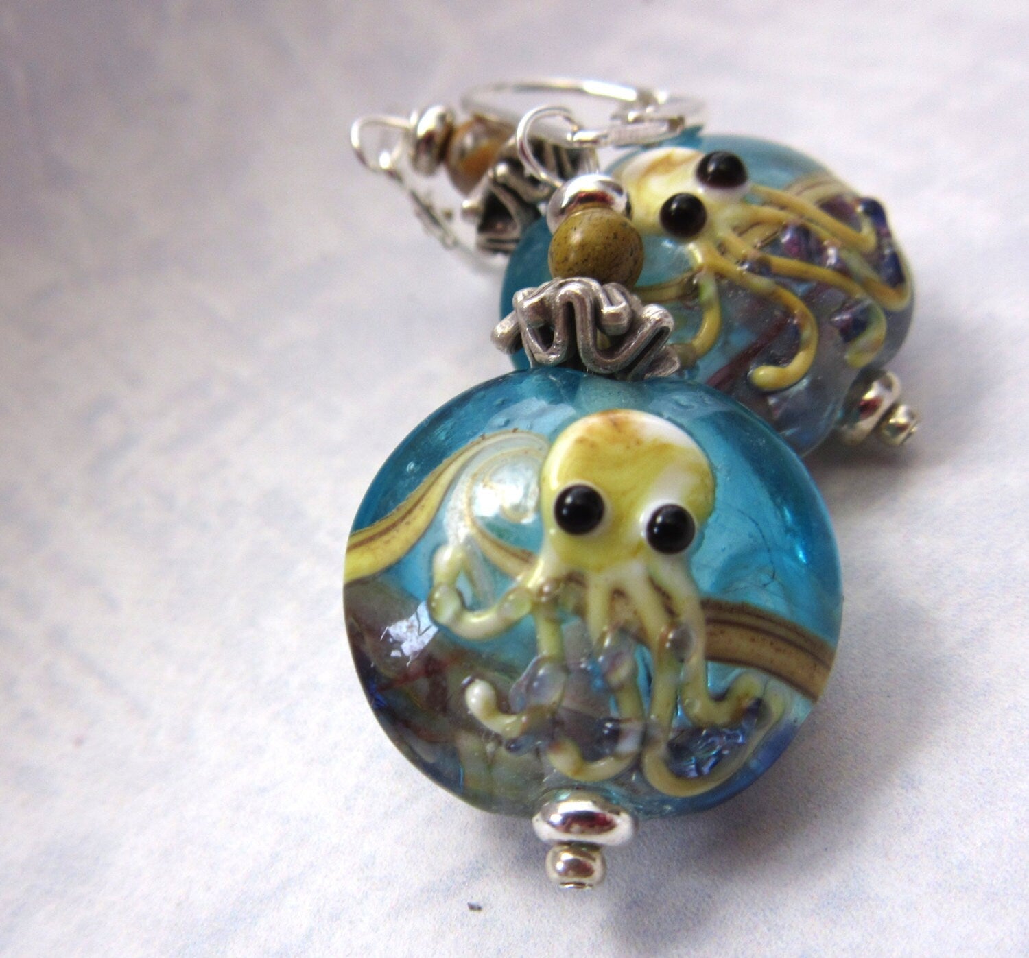 Octopus Earrings featuring handcrafted blue art glass, a unique cephalopod jewelry gift for sea life lovers.