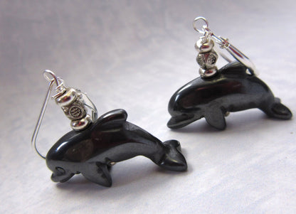 Dolphin Earrings Carved Black Hematite - Glossy detailed image of dolphin earrings, ideal gift for animal trainers and zoologists.