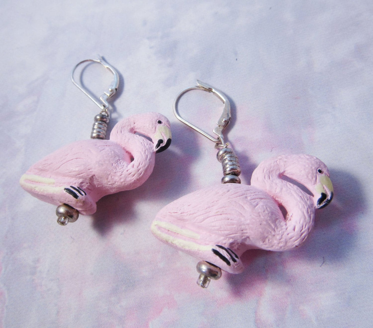 Hand Painted Ceramic Flamingo Earrings with sterling silver hooks—these funky, tropical charms brighten any look. Fun, detailed, and perfect for all occasions.