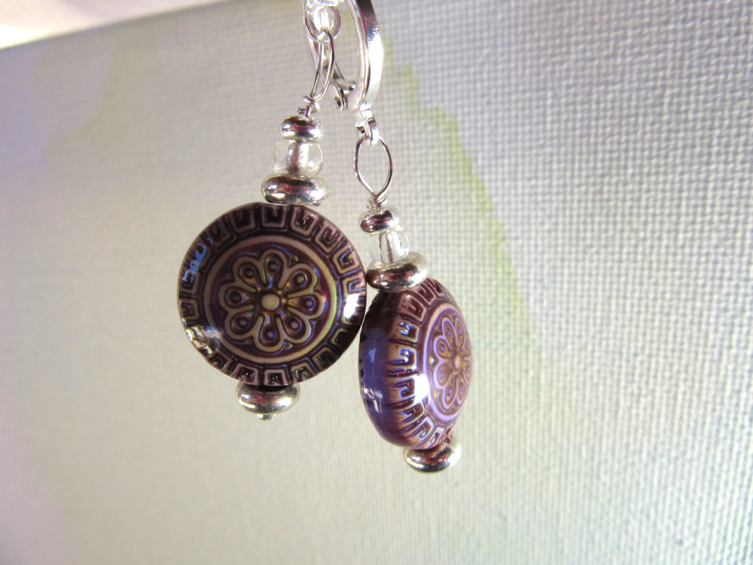 Close-up of Magic Mood Change mandala earrings featuring intricate color-changing beads in vibrant hues.