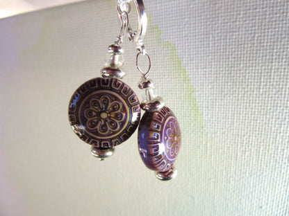 Close-up of Magic Mood Change mandala earrings featuring intricate color-changing beads in vibrant hues.
