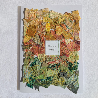Five by seven inch blank card with yellow, orange and green fabric collage; the words, thank you, hand lettered