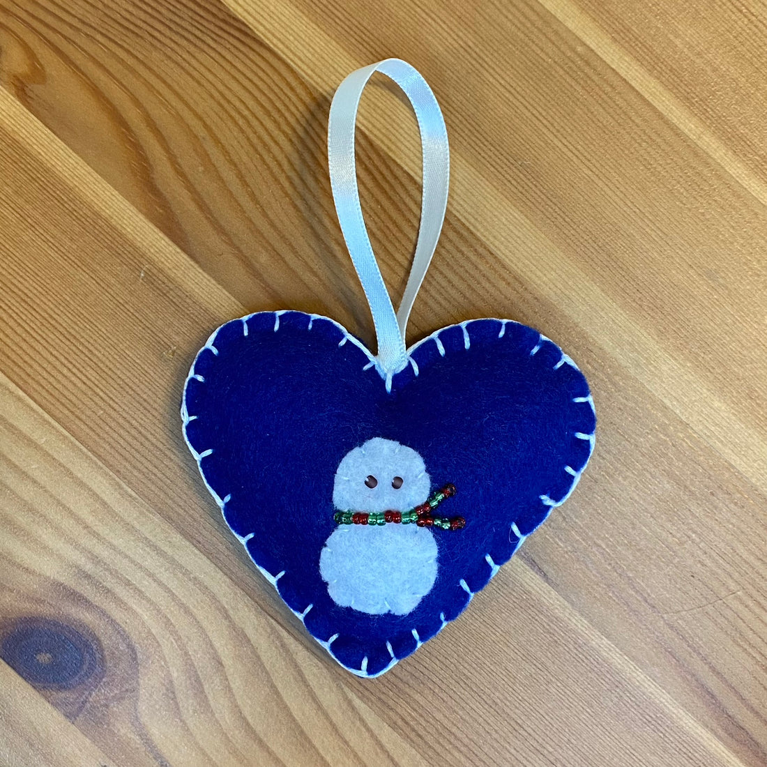 Snowman on blue felt heart Christmas ornament