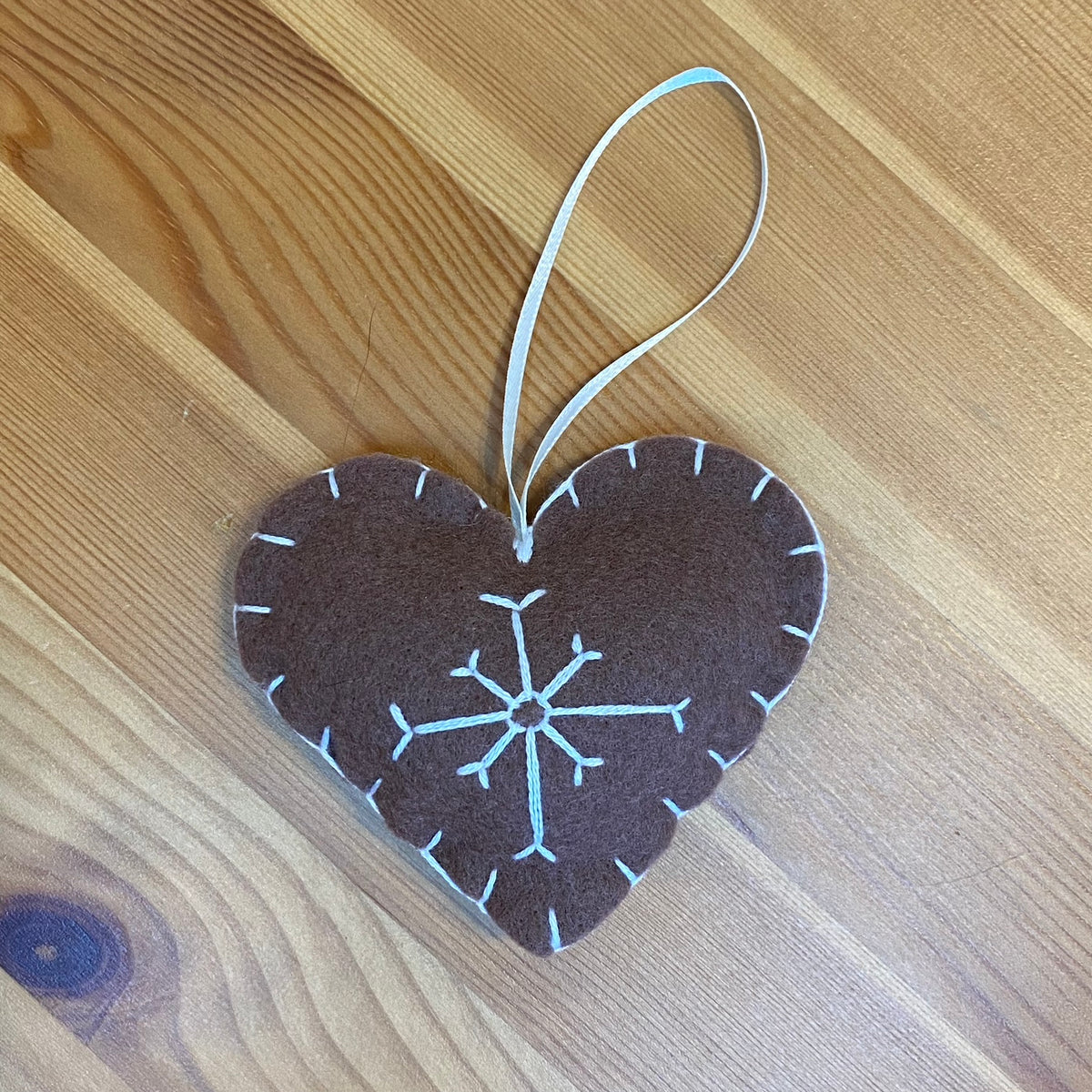 Snowflake on brown felt heart Christmas ornament