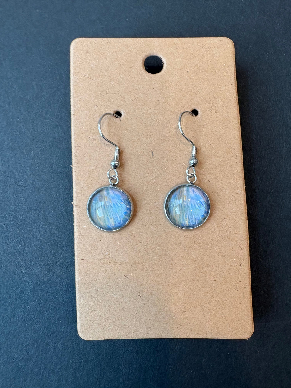 Dangly stainless steel earrings with white, blue, and yellow