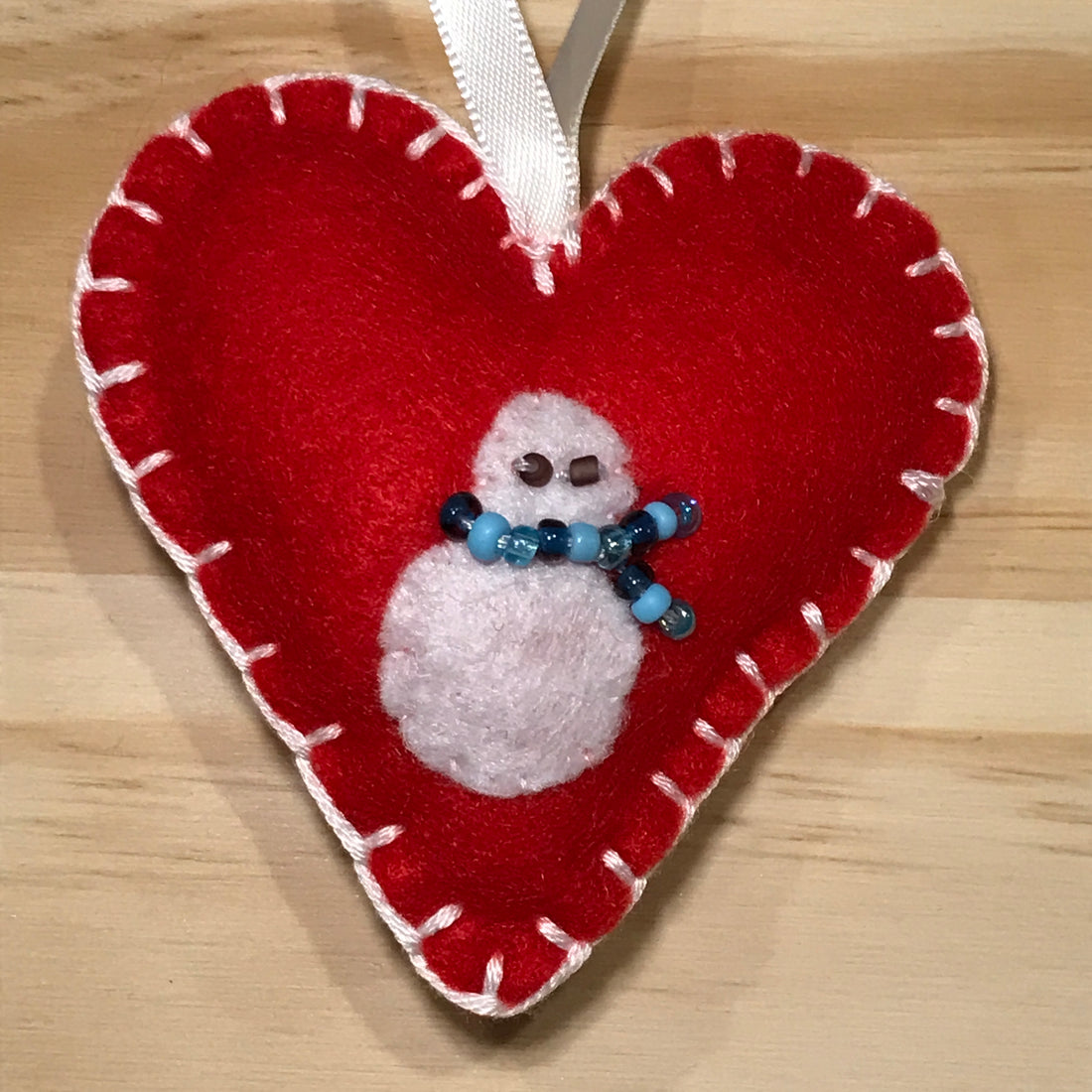 Snowman on red felt heart Christmas ornament