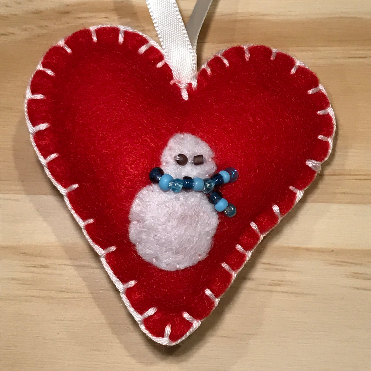 Snowman on red felt heart Christmas ornament