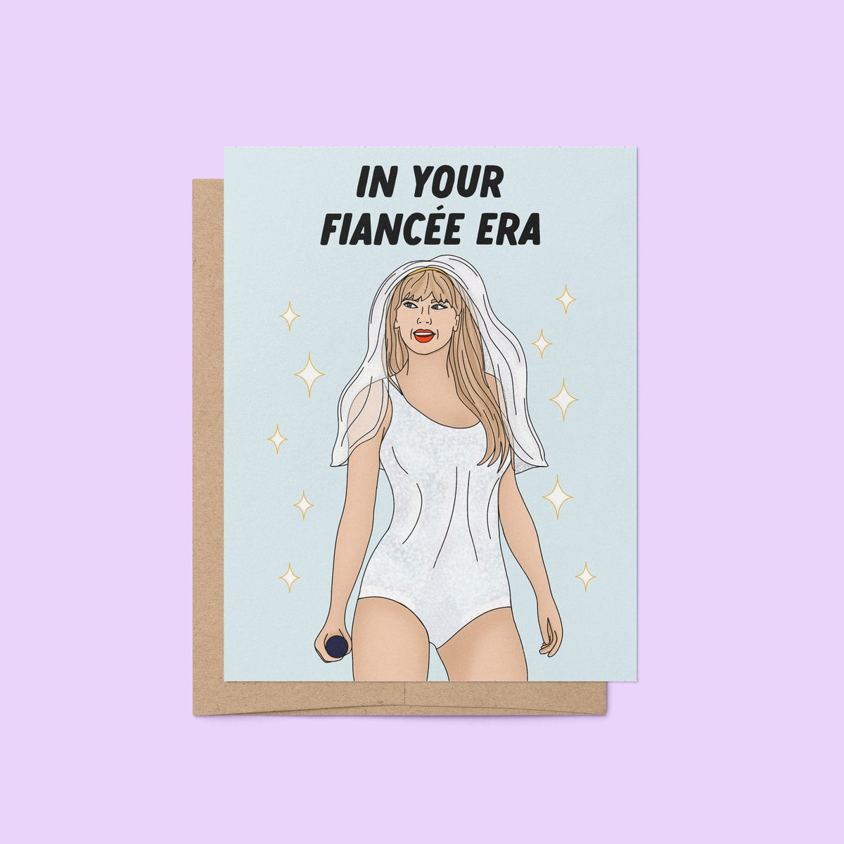 In Your Fiancee Era card flat lay — hand lettered engagement congratulations card by indie artist MangoIllustrated