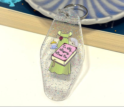 Inspired by the romance of the Regency Era, this whimsical hand drawn empire dress is paired with trinkets of the time including a cute teacup, tiara and fan! 📖 ☕ ✨👑 Perfect motel keychain for any bookish babe. Pair it with the matching sticker!
