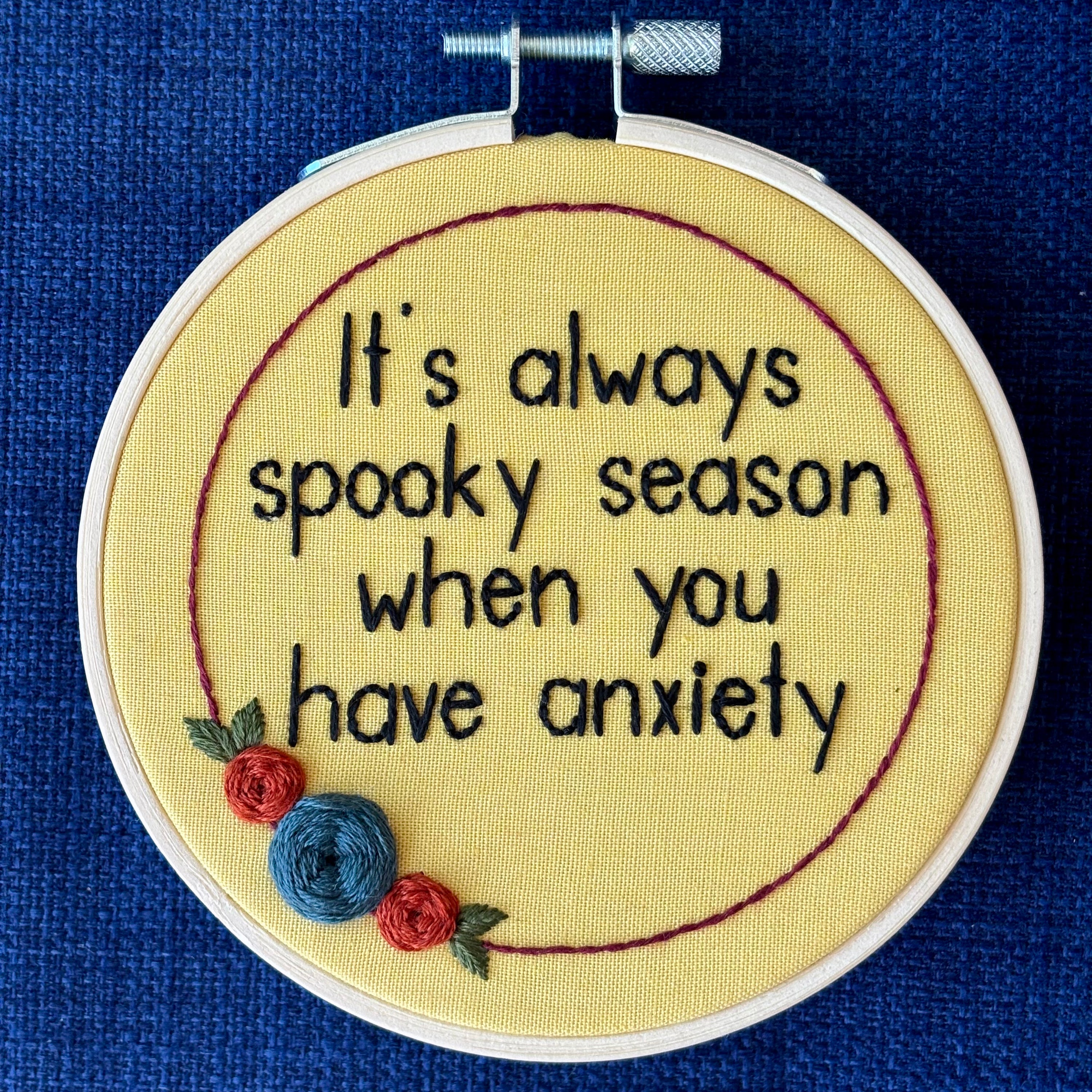 Embroidery hoop reads, "It&