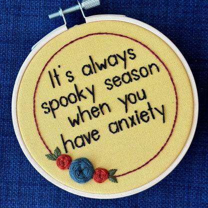 Embroidery hoop reads, "It&