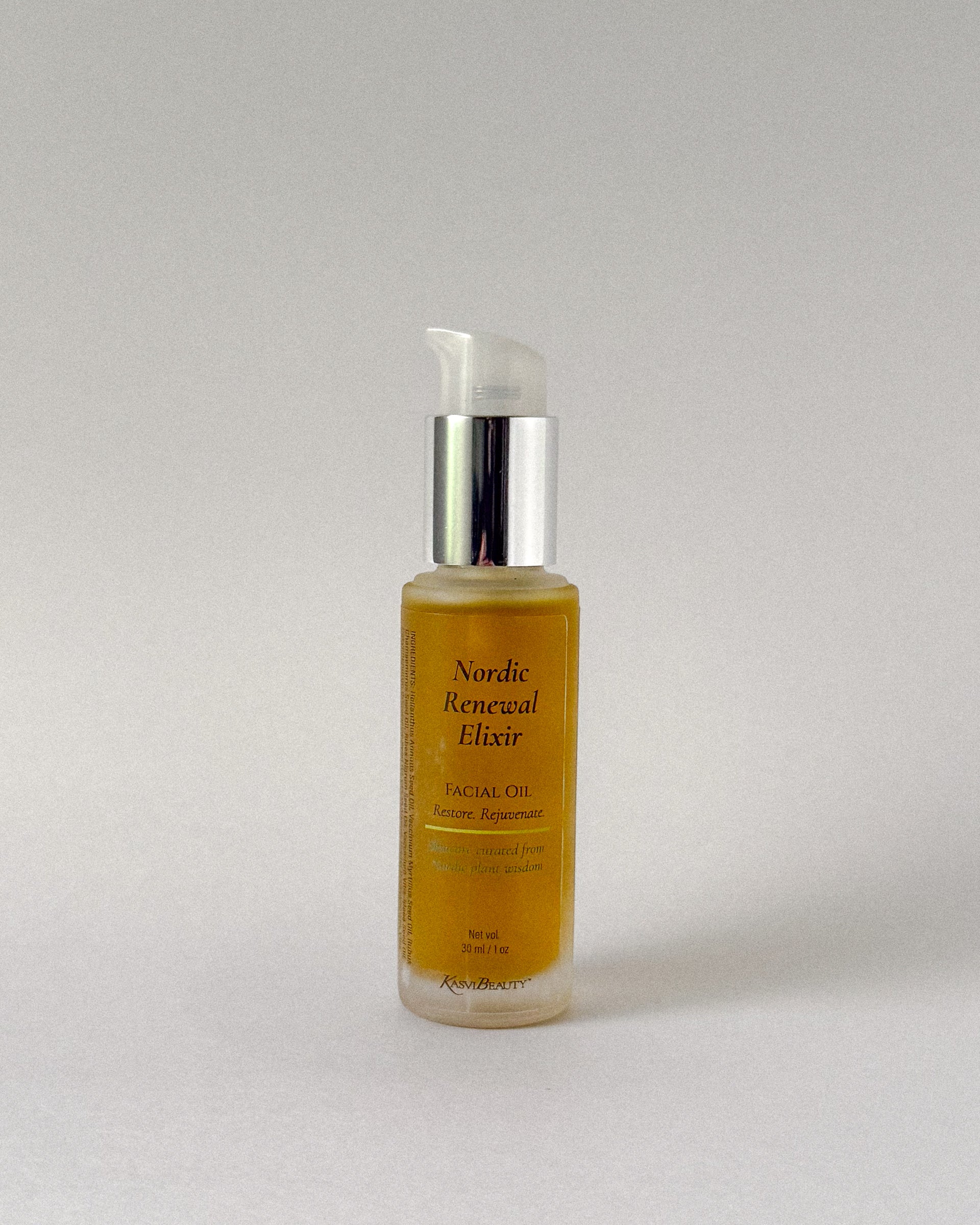 Bottle of Nordic Renewal Elixir facial oil on a light gray background