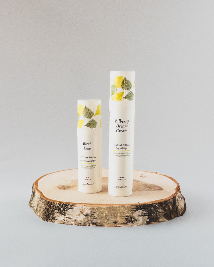 Two white cosmetic airless pump bottles labeled &