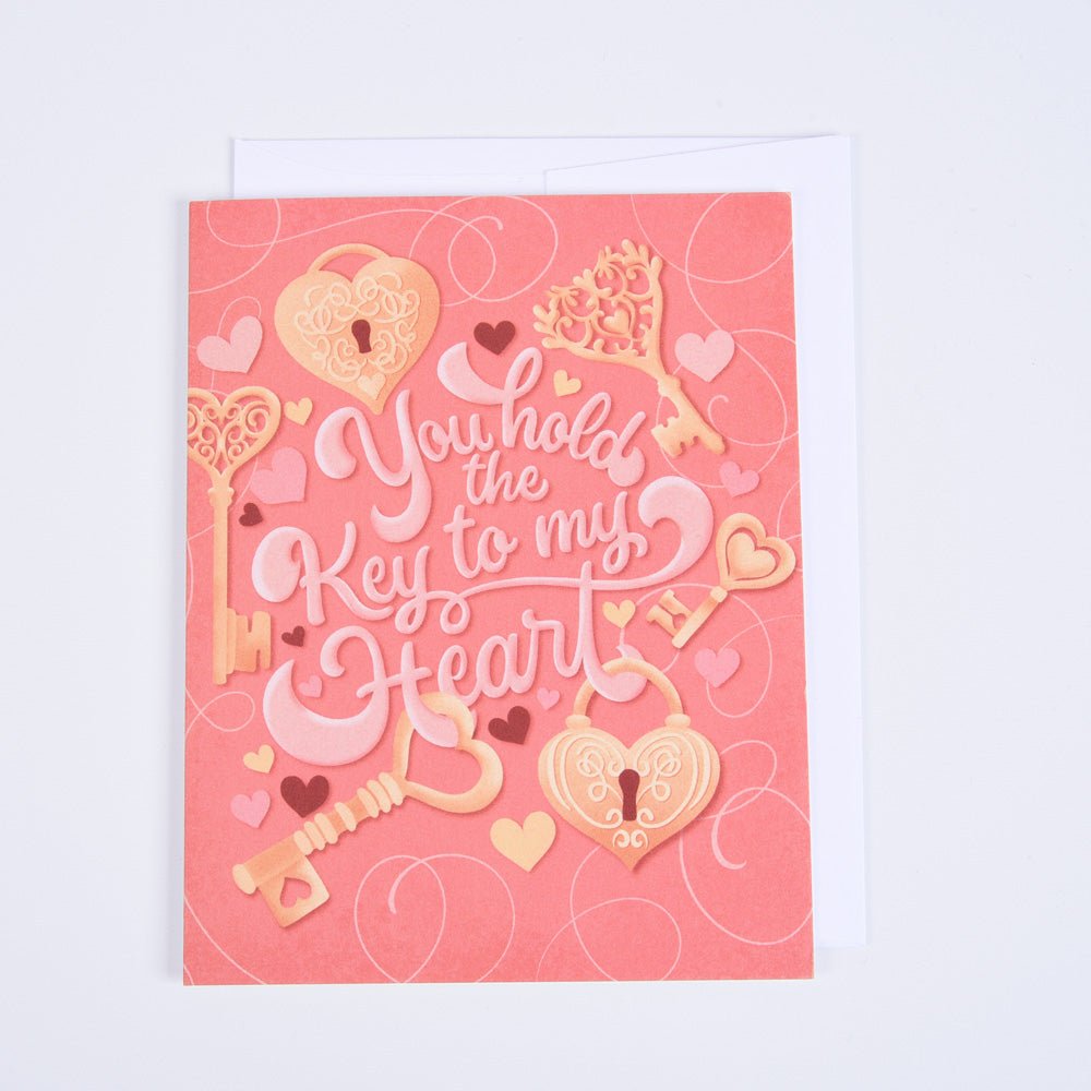 A pink folded greeting card with &