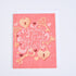 A pink folded greeting card with &
