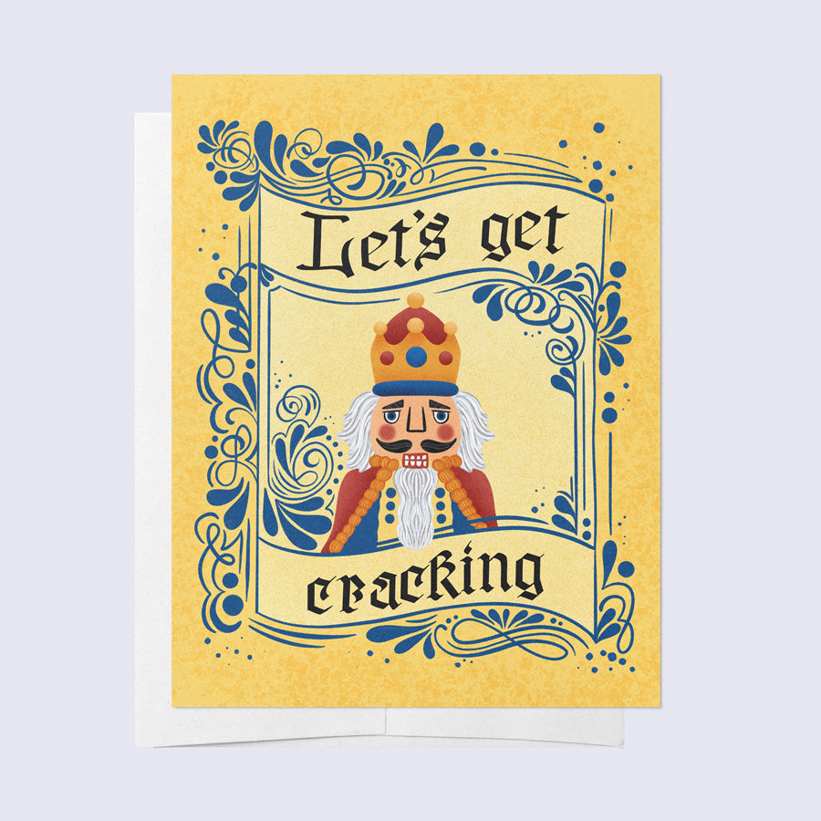 Greeting card with a cartoonish nutcracker character in a crown and robe, with the phrase &