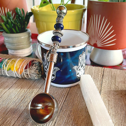 Astro Bowl Spoon with a handmade zodiac charm and natural stone handle for tea enthusiasts.