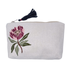 Made exclusively for Petite Protea, this natural linen pouch was hand sewn and hand embroidered with a Protea flower on the left side and a zipper closure with blue tassel, ethically made by women artisans, flat lay
