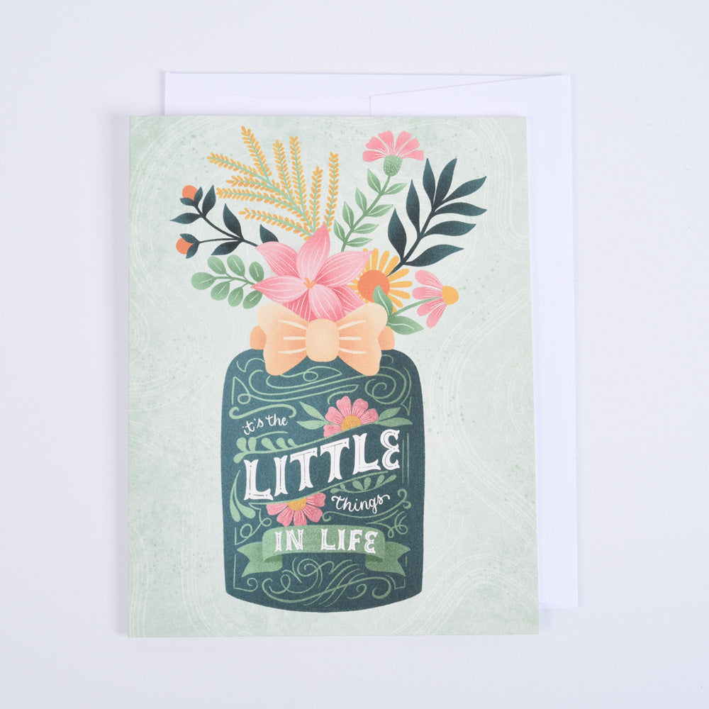 greeting card of a flower vase with text "it&