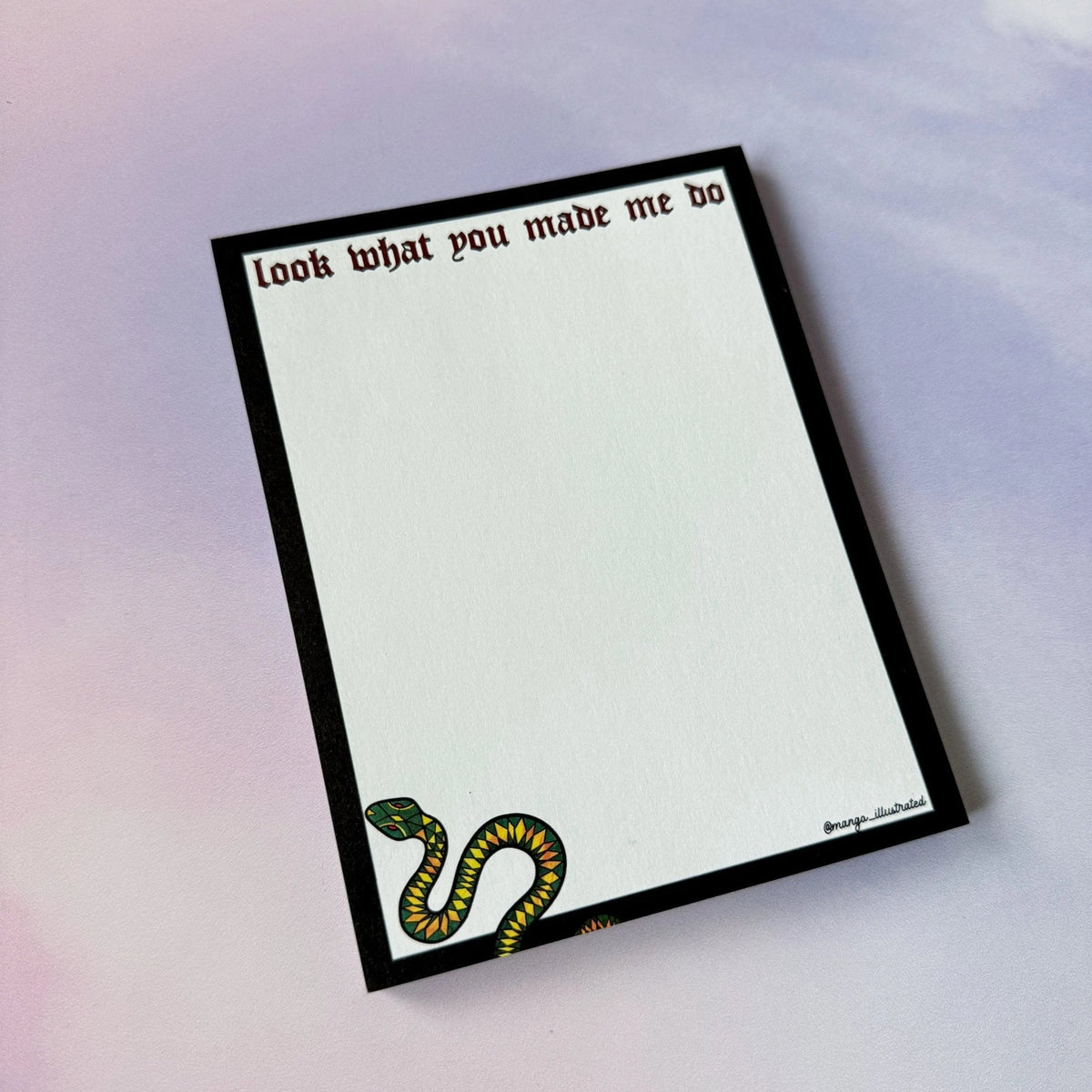 Look What You Made Me Do notepad detail — hand drawn green snake with ruby eyes by indie artist MangoIllustrated