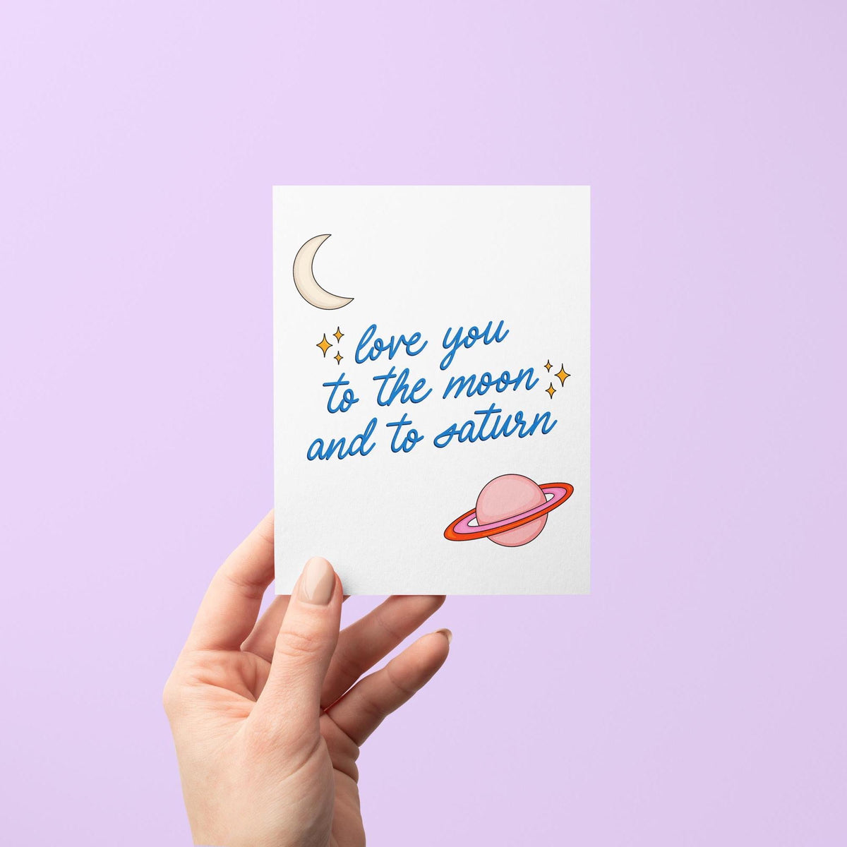 Love you to the moon and to Saturn card detail — close-up of the illustrated moon, Saturn and stars by indie artist MangoIllustrated