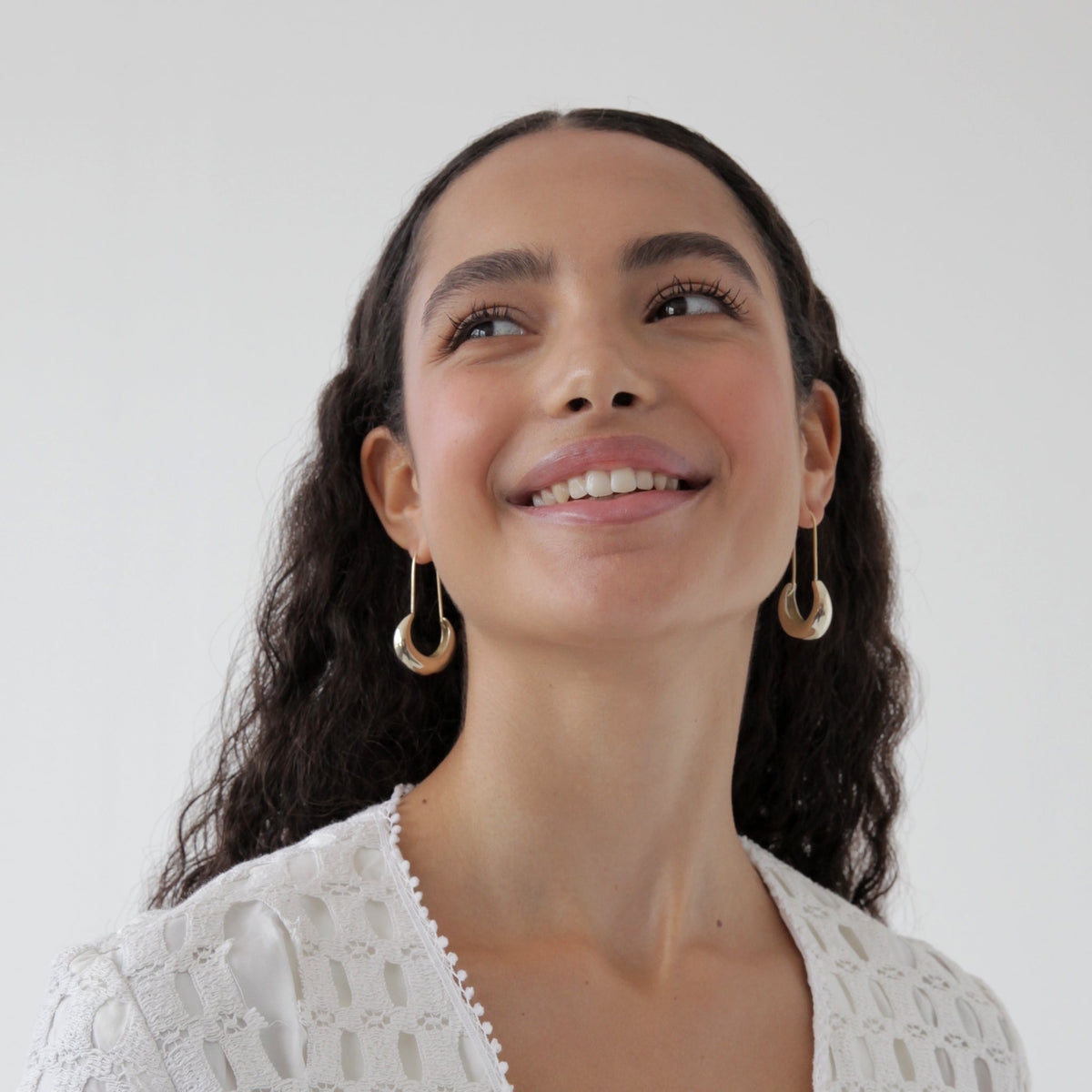Lua brass hoop earrings seen in Vogue, ethical and sustainable gift at Petite Protea. Jewelry worn by Michelle Obama.