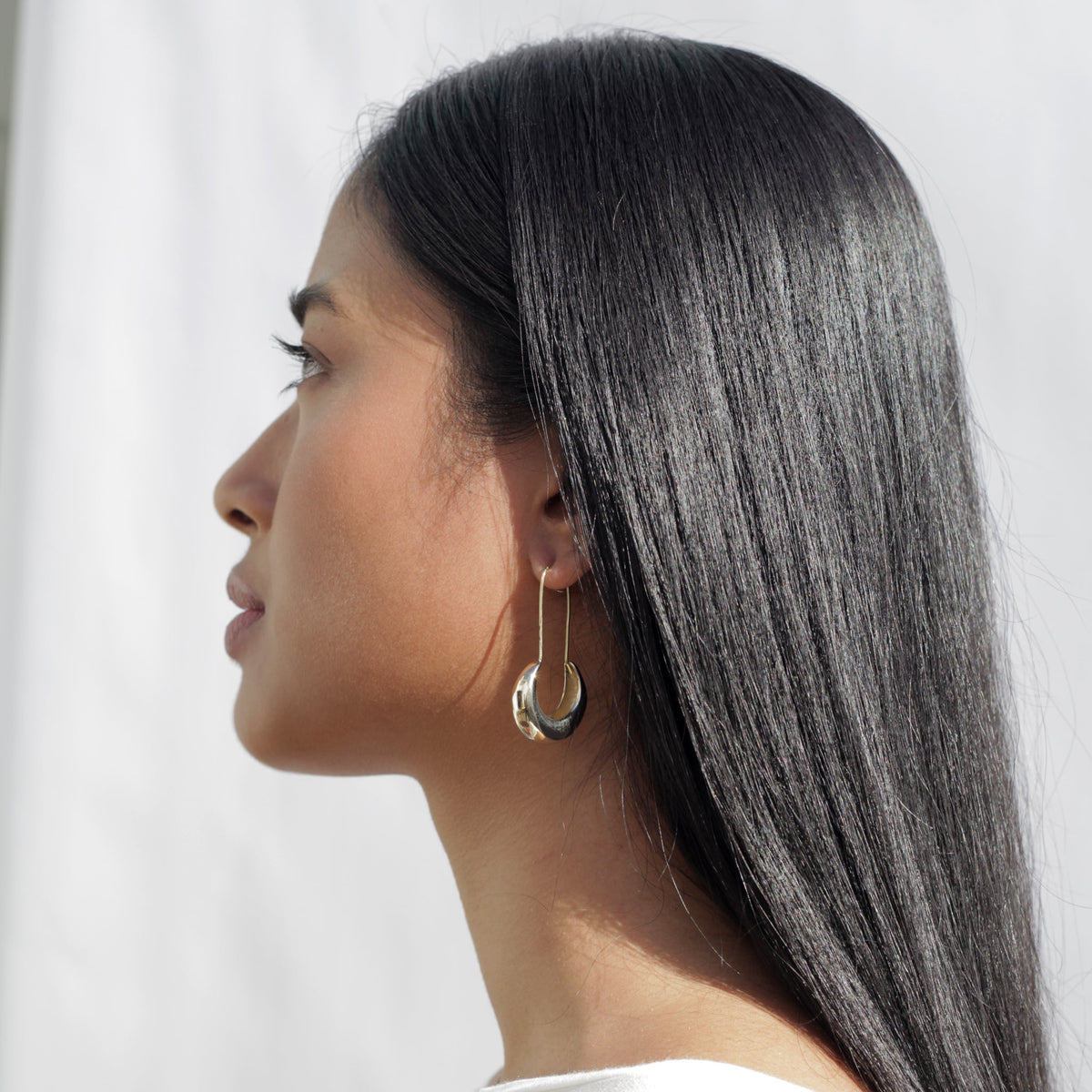 Lua gold moon hoop earrings, jewelry featured in Vogue, ethically handmade in Cape Town, sold in the US at Petite Protea