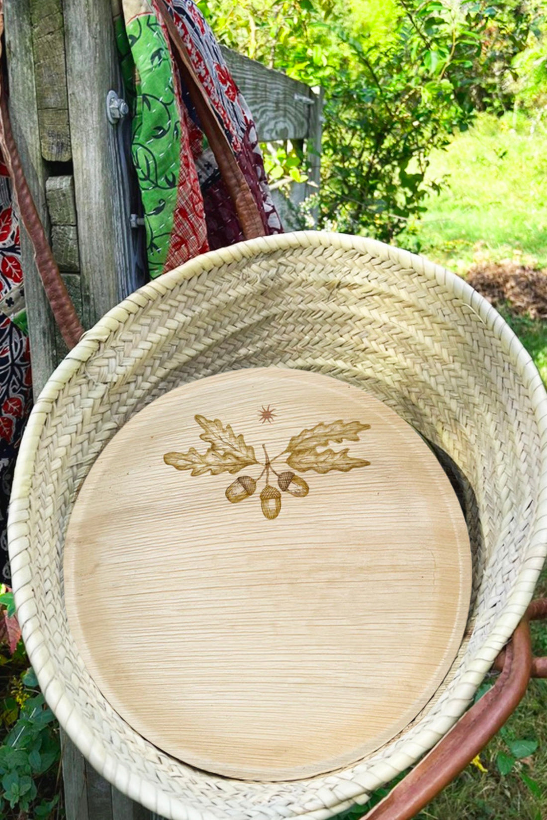 maaterra compostable plate with acorn design in a basket.