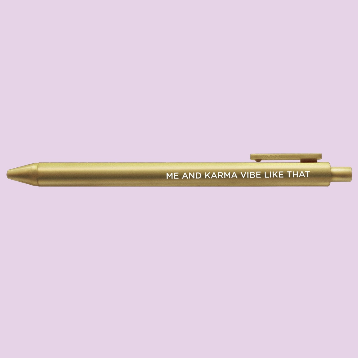 Me and Karma Vibe Like That jotter gel pen angled view — gold jotter gel pen with black gel ink by indie artist MangoIllustrated