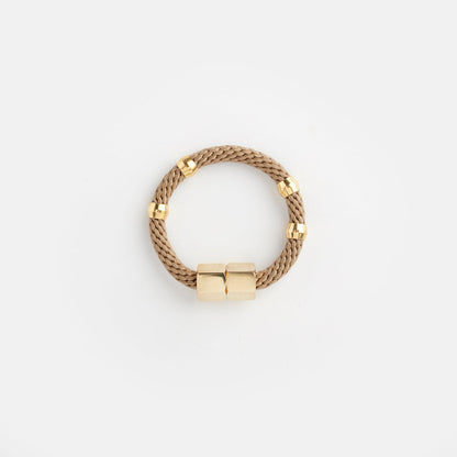 mer bracelet in beige, handmade by women artisans, women-owned jewelry company chicago 