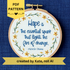 PDF pattern created by Kate, not AI. "Hope is the essential spark that lights the fire of change. Michelle Obama" Quote hand embroidered in dark blue. Text is surrounded by floral wreath of golden yellow sunflowers and dark green stems with light yellow buds. Fabric is white-on-white cotton. Displayed as wall art in a light wooden embroidery hoop.