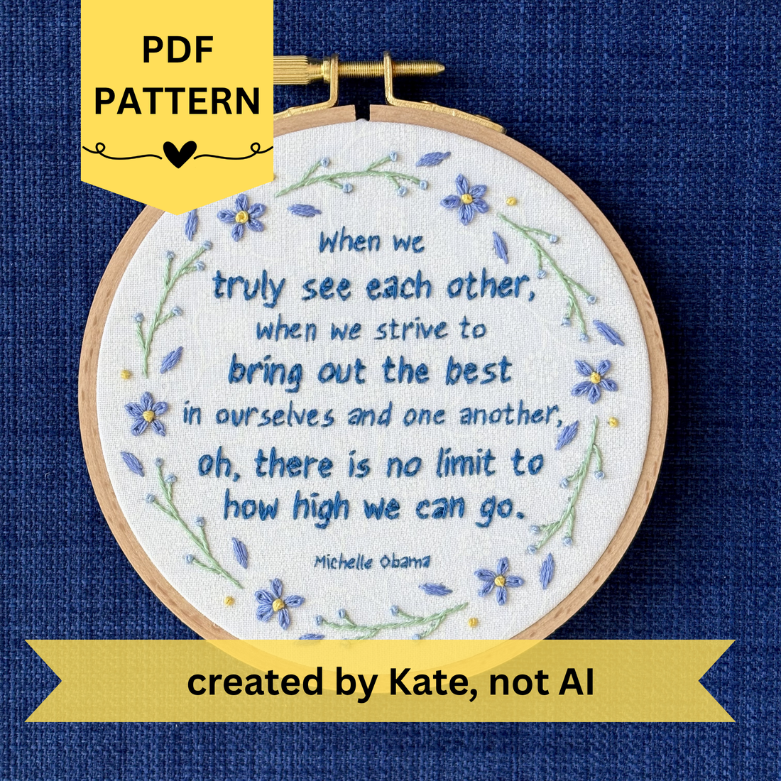 PDF pattern created by Kate, not AI. "When we truly see each other, when we strive to bring out the best in ourselves and one another, oh, there is no limit to how high we can go. Michelle Obama." Quote hand embroidered in dark blue. Text is surrounded by floral wreath of periwinkle blue forget-me-not flowers and light green stems with light blue buds. Fabric is white-on-white cotton. Displayed as wall art in a light wooden embroidery hoop.
