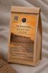 A kraft paper coffee bag labeled &