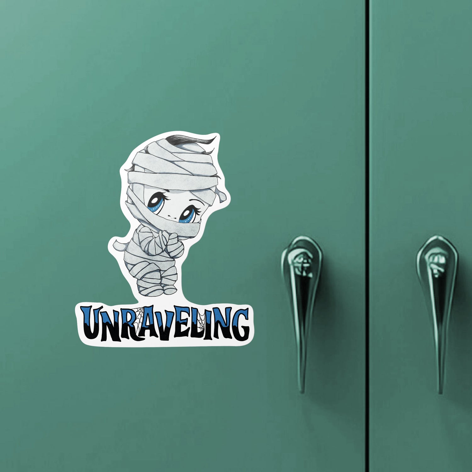 Chibi mummy monster sticker on a green metal locker door