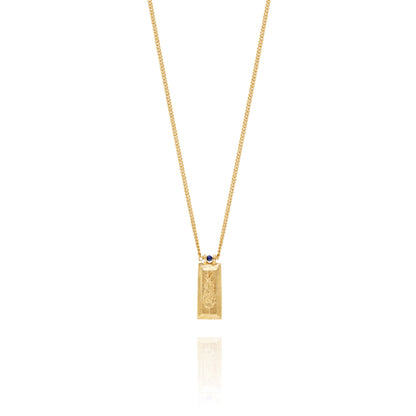 Handmade gold necklace with lavender motif on each side and lapis lazuli bead on a delicate curb chain, ethical artisan jewelry online
