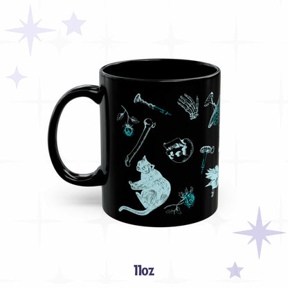 11 oz cybergoth mug with cyan skull, bones, a seated black cat, and a rose on glossy black ceramic