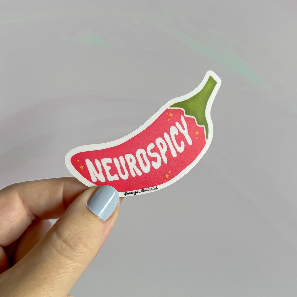 Neurospicy sticker detail — close up of the hand lettered chili pepper design by indie artist MangoIllustrated