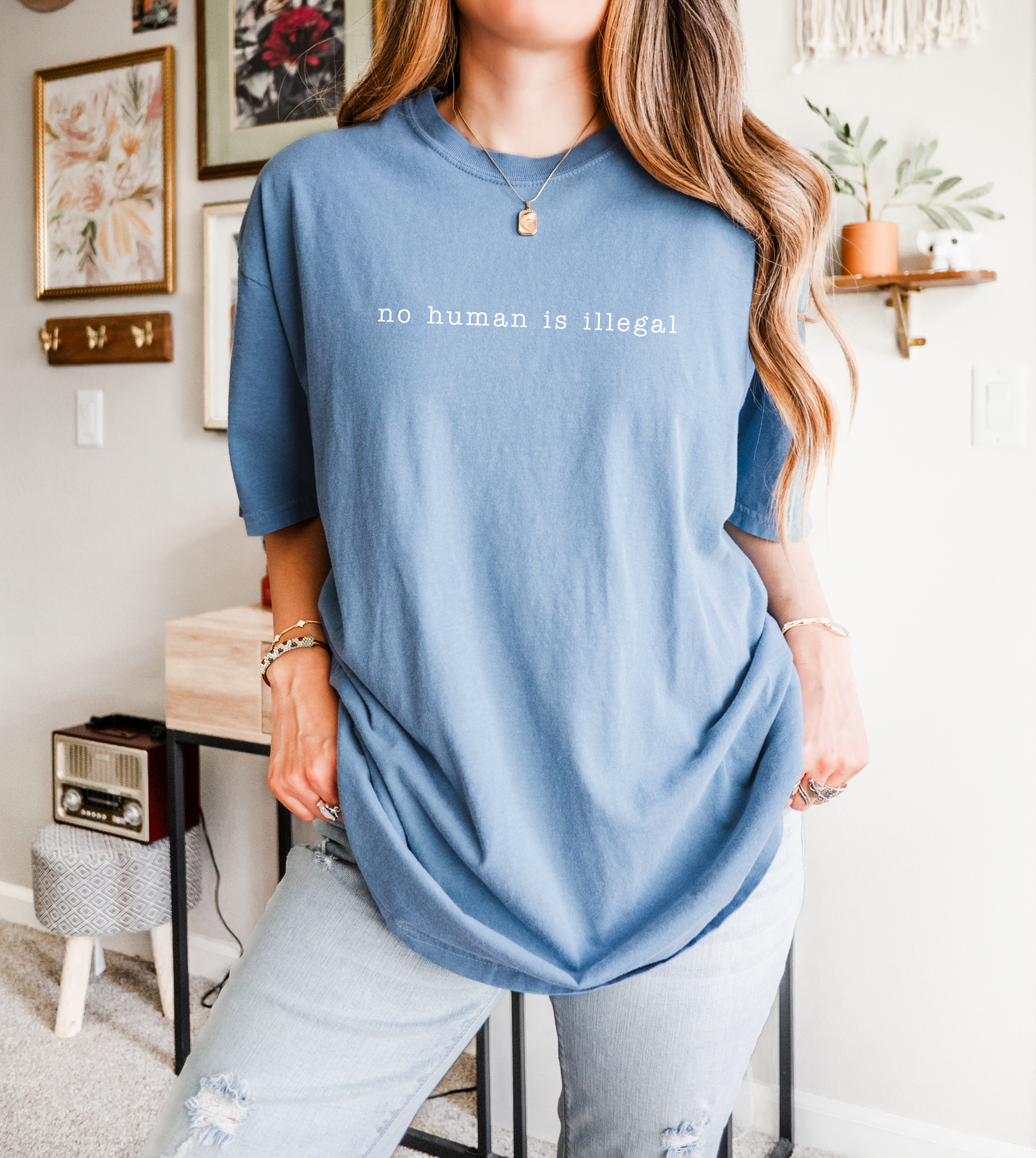 Person wearing a blue t-shirt with &