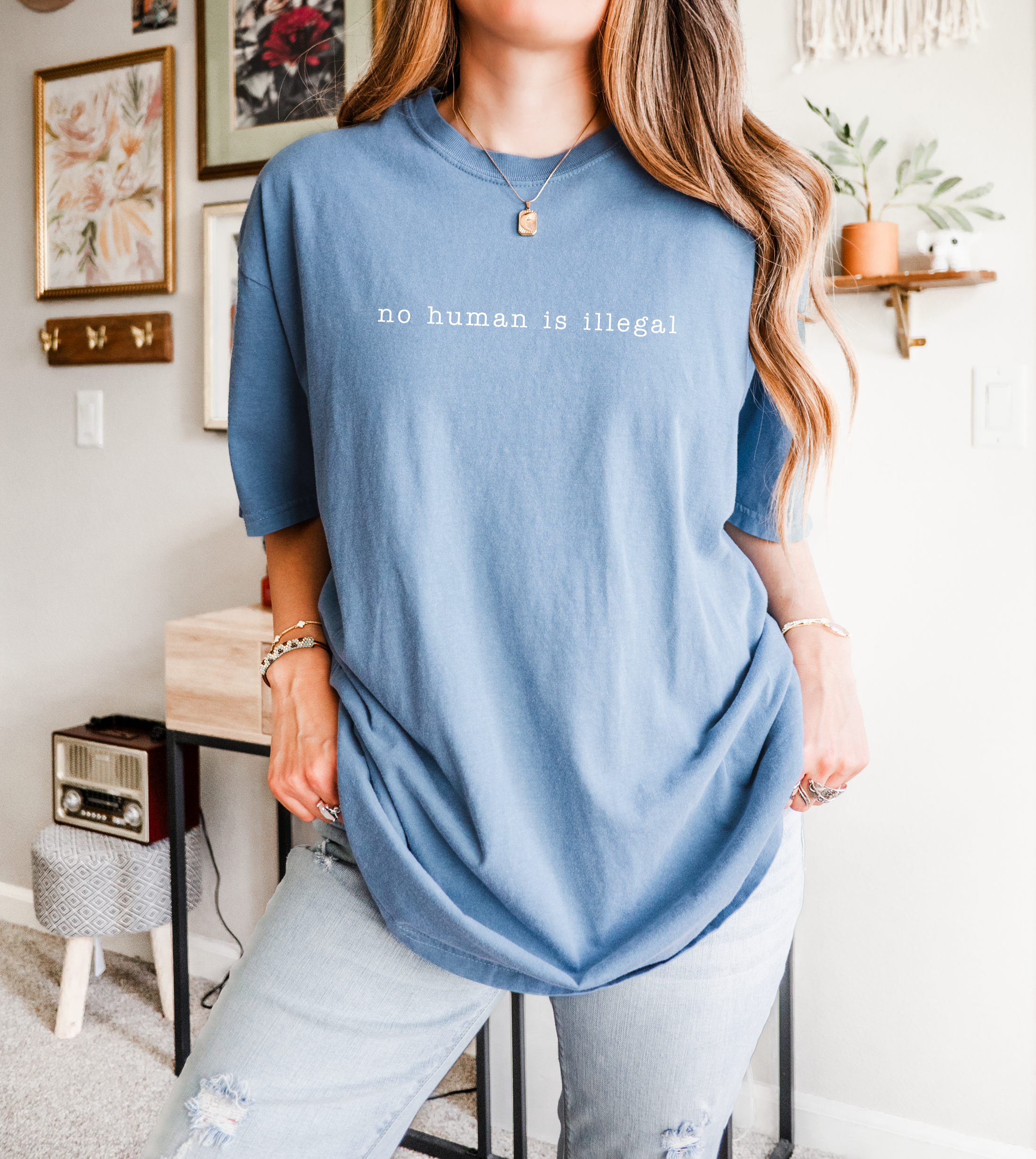 Person wearing a blue t-shirt with &