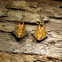 Hand-painted wooden Anubis dangle earrings featuring the jackal-headed Egyptian god with detailed ancient Egyptian artwork. Crafted from lightweight wood with hypoallergenic .925 sterling silver hooks, these mythological earrings are perfect for history lovers, Egyptology enthusiasts, mythology fans, museum gift shoppers, gothic fashion, and anyone who appreciates ancient civilization-inspired jewelry.