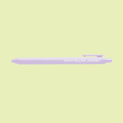 On my hilling journey pen flat lay — lilac quote gel pen with black ink by indie artist MangoIllustrated
