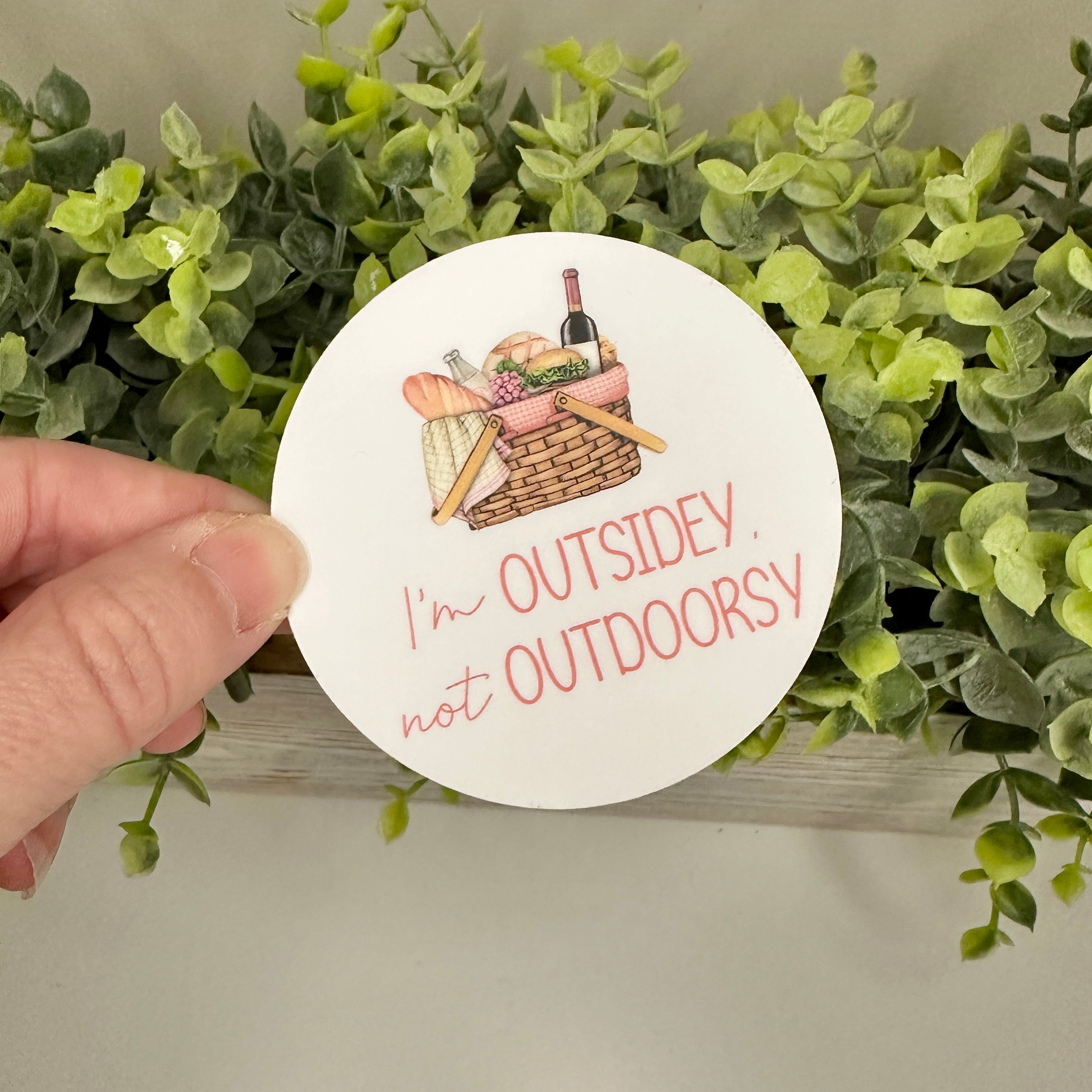 Circular sticker with picnic illustration and text &