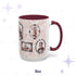 Fifteen-ounce oxblood portrait mug upright on a starred background, red transferware frames of skeleton-faced Victorian sitters, burgundy handle