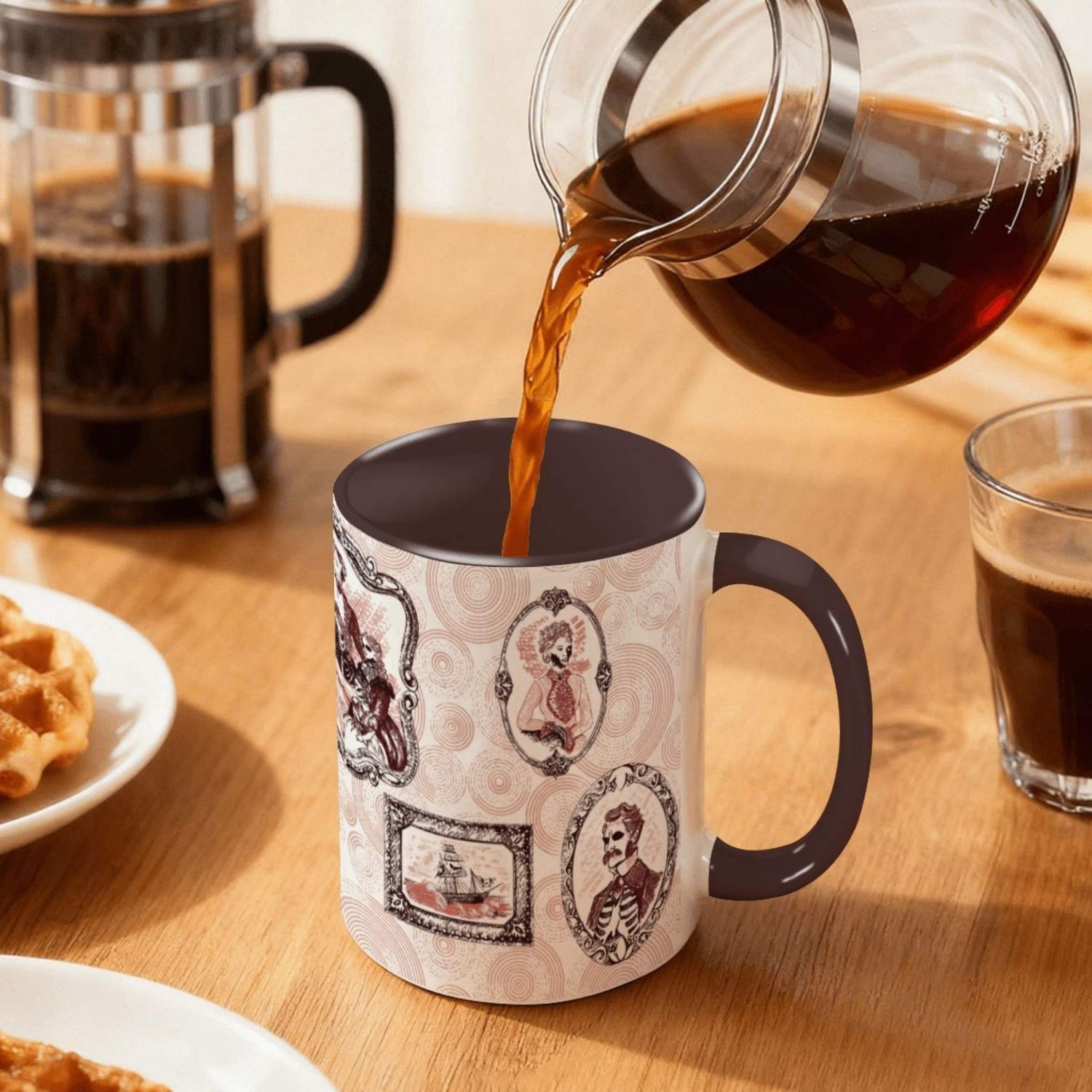 Coffee pouring into the oxblood Victorian zombie mug on a wood table beside a French press, red ancestral frames wrapping the ceramic