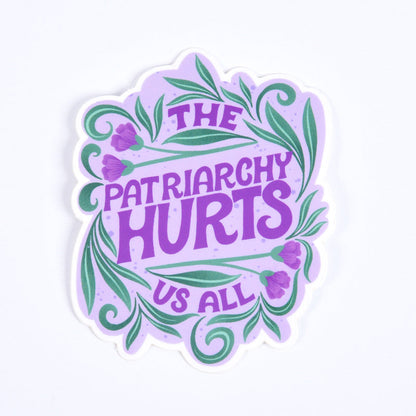 A sticker with a purple background and the text &