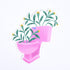 A sticker depicting a pink toilet bowl filled with green plants.
