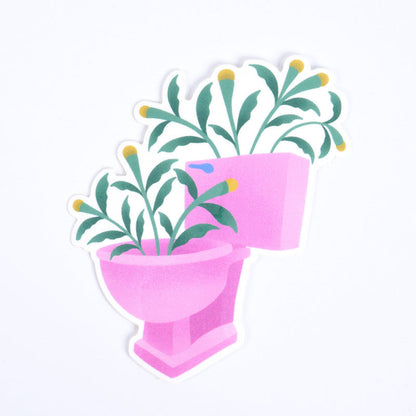 A sticker depicting a pink toilet bowl filled with green plants.