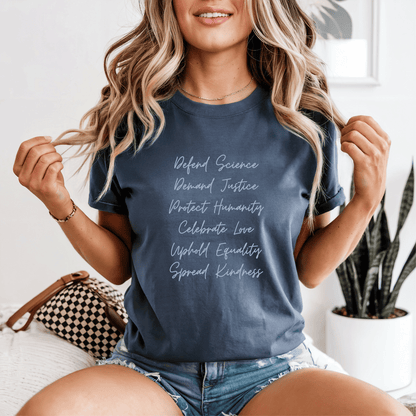 Defend Science Demand Justice Protect Humanity Celebrate Love Uphold Equality Spread Kindness progressive graphic t-shirt on Comfort Colors denim blue shirt