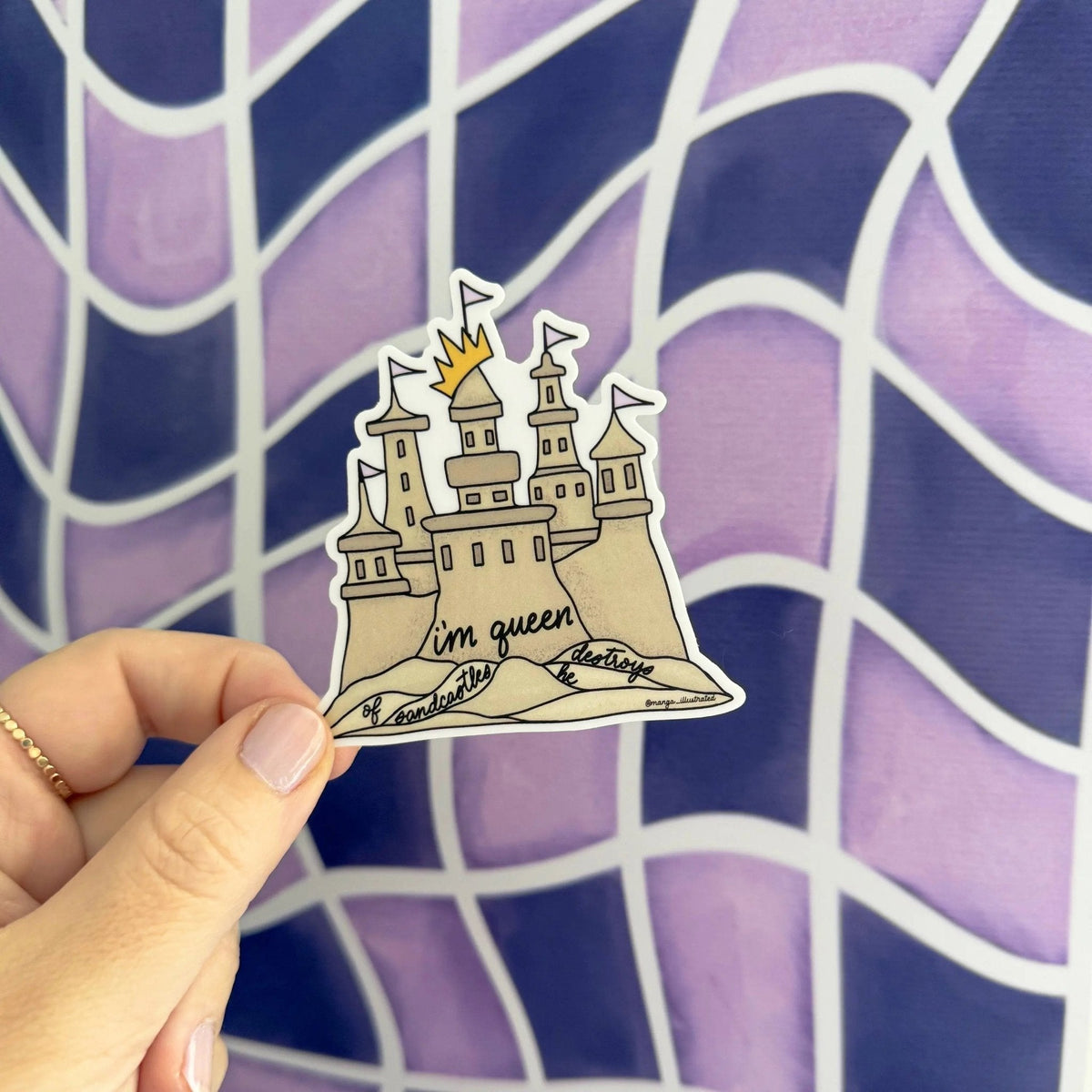 Queen of sandcastles sticker flat lay — illustrated sandcastle vinyl sticker by indie artist MangoIllustrated