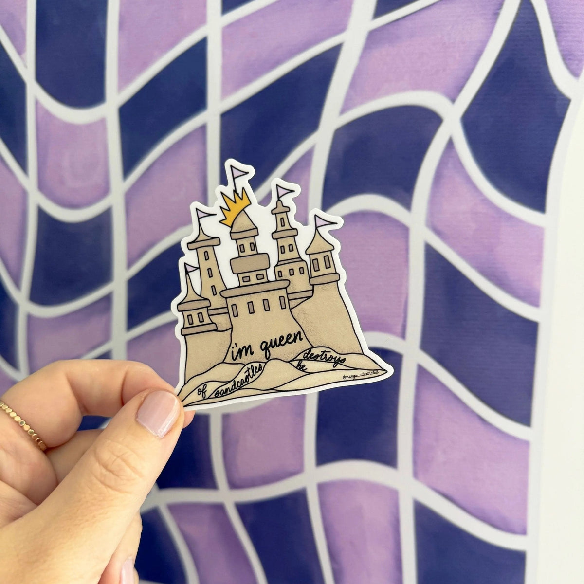Queen of sandcastles sticker angled view — waterproof vinyl laptop and water bottle sticker by indie artist MangoIllustrated